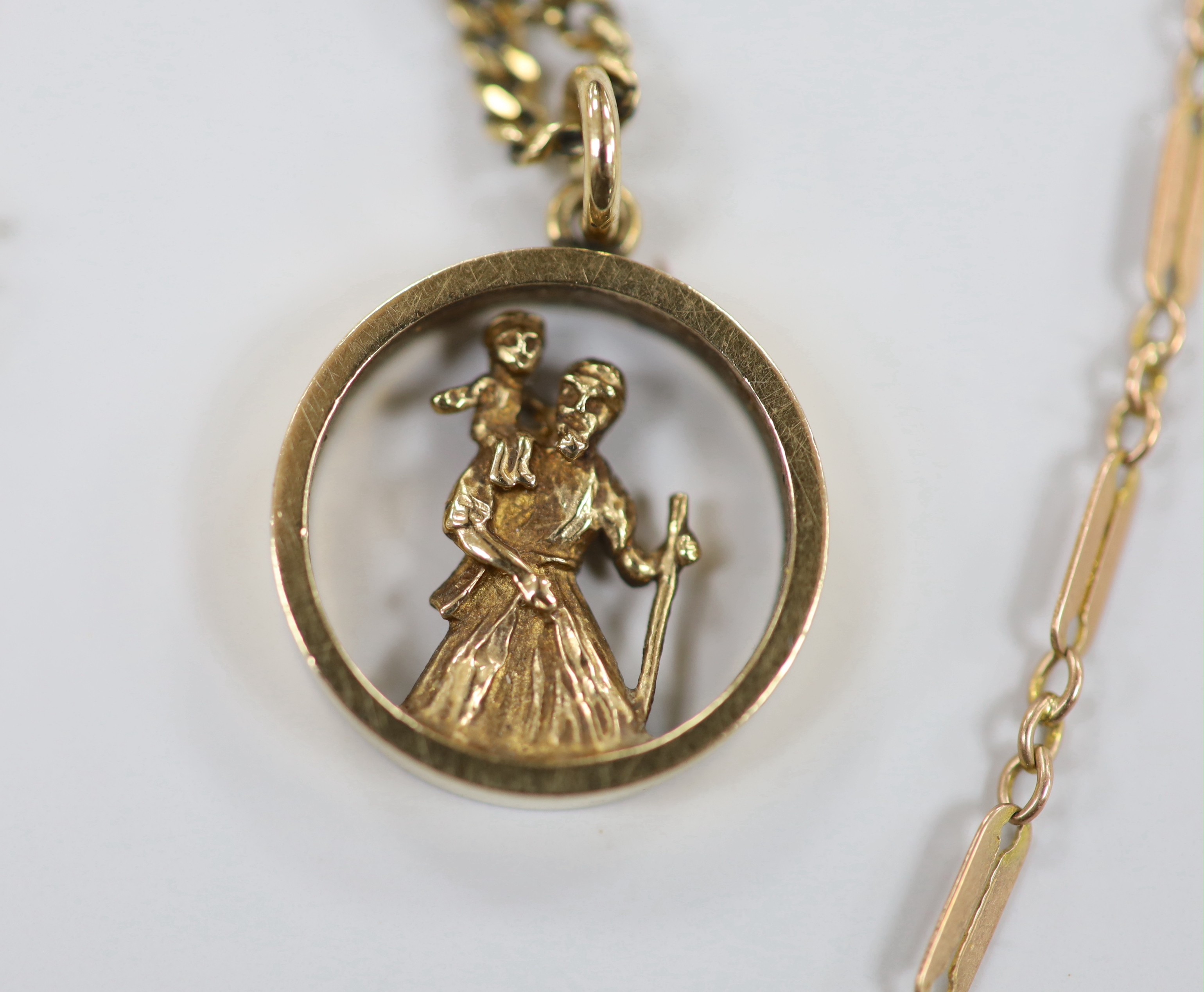 Two 9ct pendant necklaces, one with cross pendant, a 9ct gold hinged bangle and a 9ct chain, 23.4 grams.